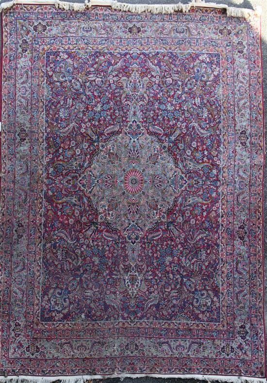 A Kashan red ground carpet, 10ft 2in by 7ft 10in.